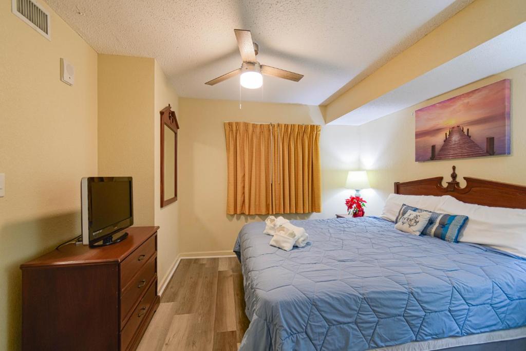 a bedroom with a bed with a teddy bear on it at Atlantica Resort in Myrtle Beach