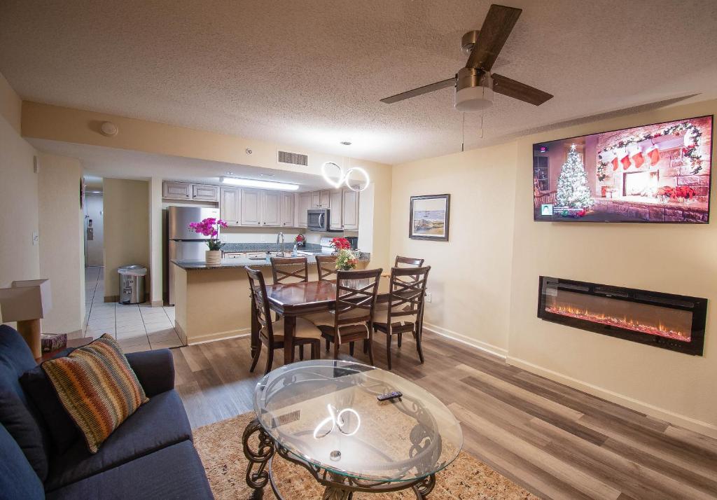a living room with a couch and a dining room at Atlantica Resort in Myrtle Beach