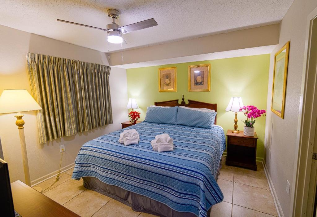 a bedroom with a bed with two towels on it at Atlantica Resort in Myrtle Beach