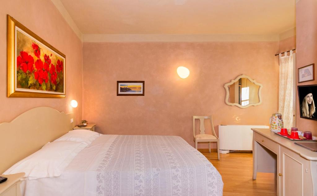 Postel nebo postele na pokoji v ubytování Residenza d'Epoca Relais I Miracoli