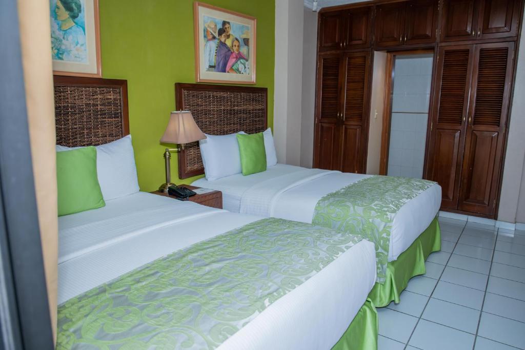 Postel nebo postele na pokoji v ubytování Aparthotel Guijarros