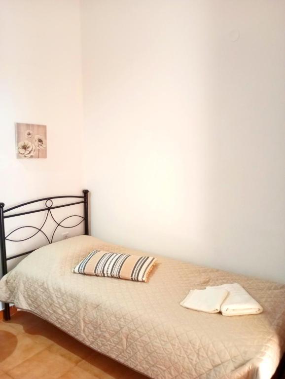 A bed or beds in a room at Villa Stella Family House
