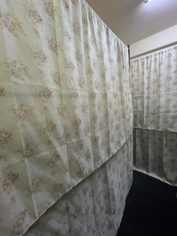 a bedroom with a curtain in a room at Sphinx Hostel in Dubai