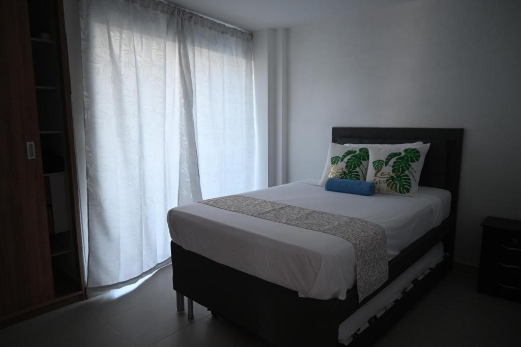 Postel nebo postele na pokoji v ubytování Travelu Guatape Apartamento