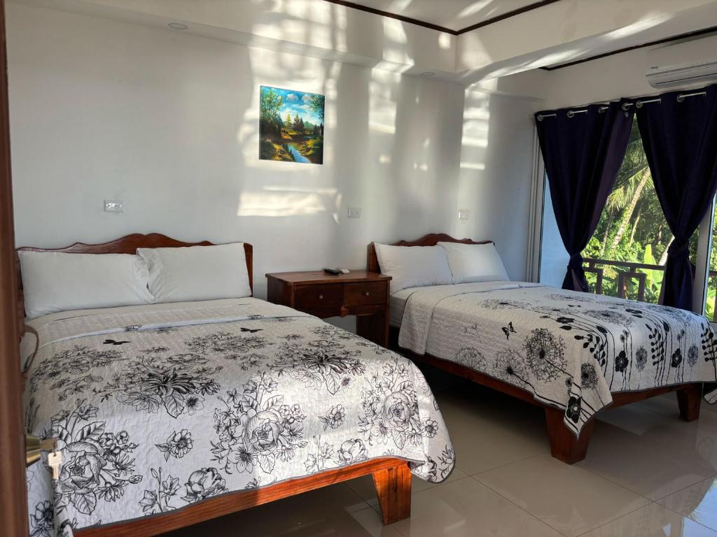 Postel nebo postele na pokoji v ubytování Hotel Coco Beach