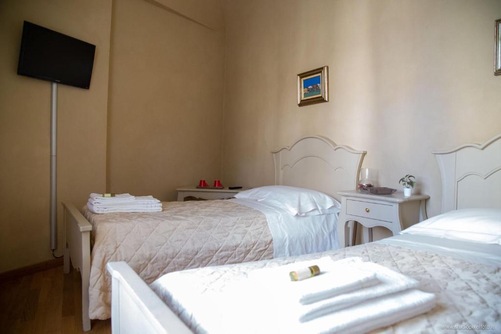 Postel nebo postele na pokoji v ubytování Residenza d'Epoca Relais I Miracoli
