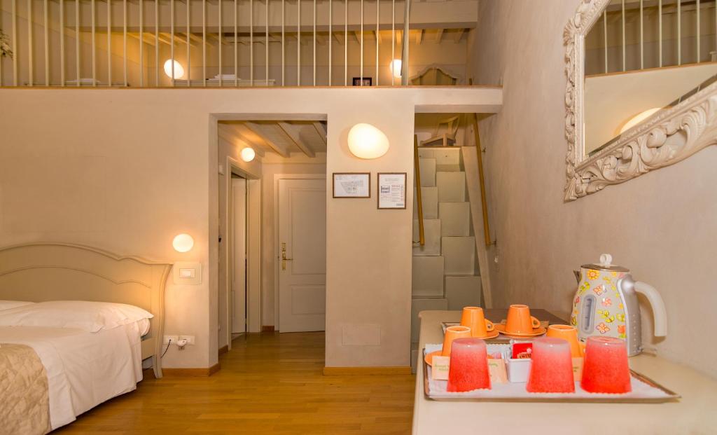Postel nebo postele na pokoji v ubytování Residenza d'Epoca Relais I Miracoli