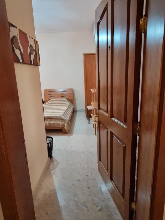 Postel nebo postele na pokoji v ubytování Saracini's Homestay