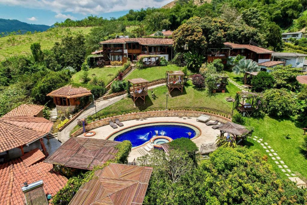 an aerial view of a house with a swimming pool at Hotel Spa La Colina in Pereira