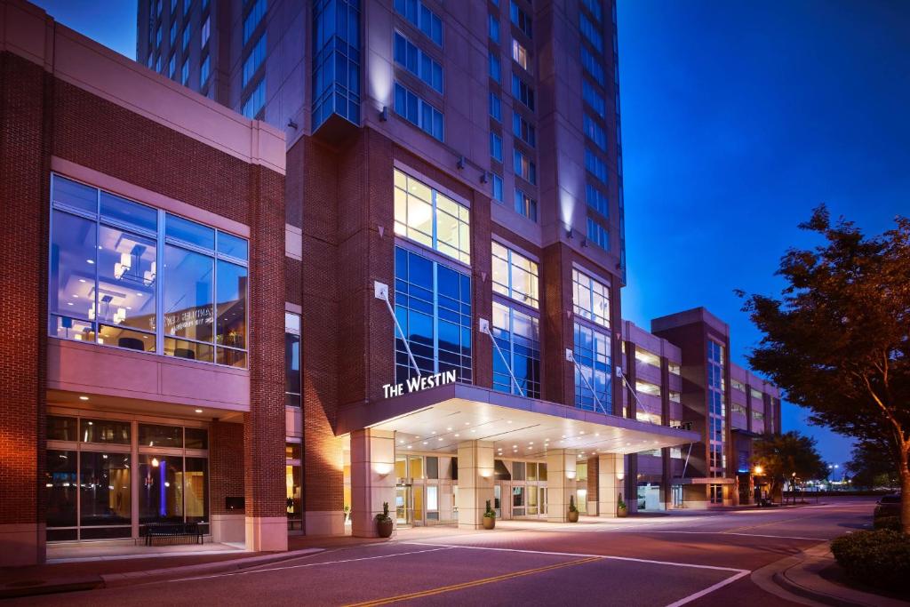 a building on a city street at night at The Westin Virginia Beach Town Center in Virginia Beach