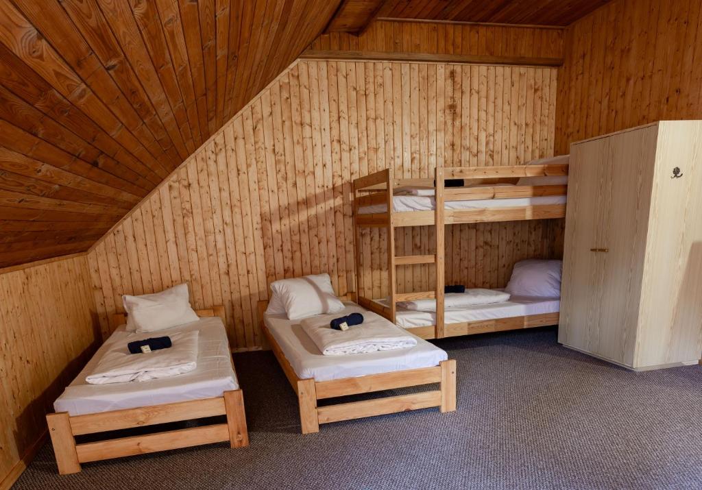 Postel nebo postele na pokoji v ubytování Penzion a Restaurace Kamínek