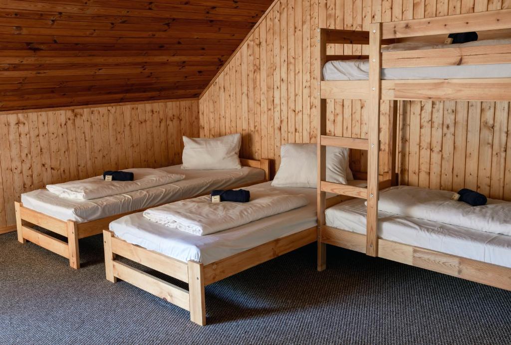 Postel nebo postele na pokoji v ubytování Penzion a Restaurace Kamínek