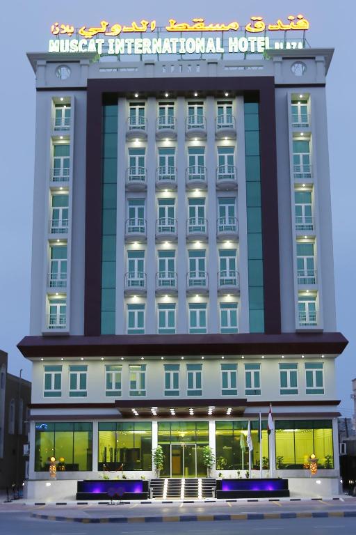 a hotel building with a sign on top of it at Muscat International Hotel Plaza in Salalah
