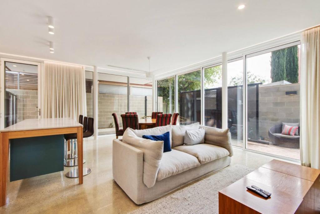 a living room with a couch and a table at Apartment G4 in Adelaide