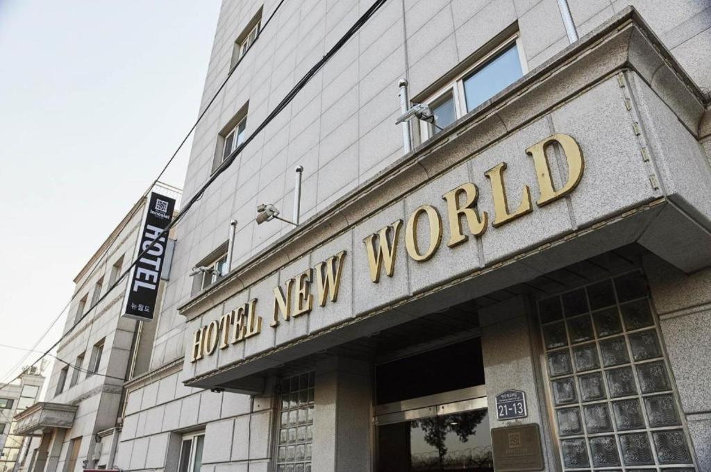 a building with a hotel new world sign on it at New World Hotel Yongsan in Seoul