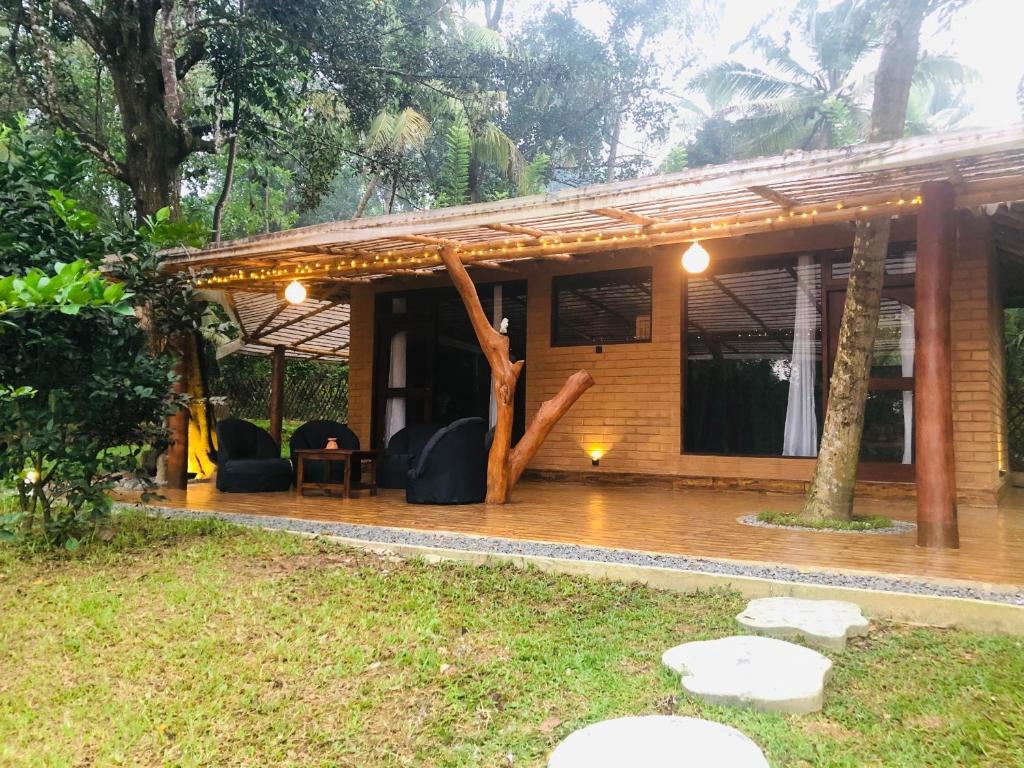 a patio of a house in the rain at Outskirts Of Heaven in Kamburugamuwa