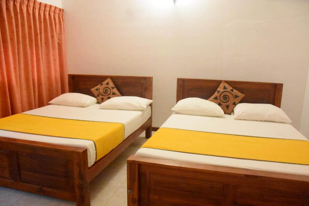 Postel nebo postele na pokoji v ubytování Yellow Birds Resort