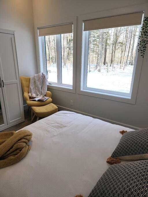 Postel nebo postele na pokoji v ubytování Chalet TERRE en harmonie avec la nature, Tremblant