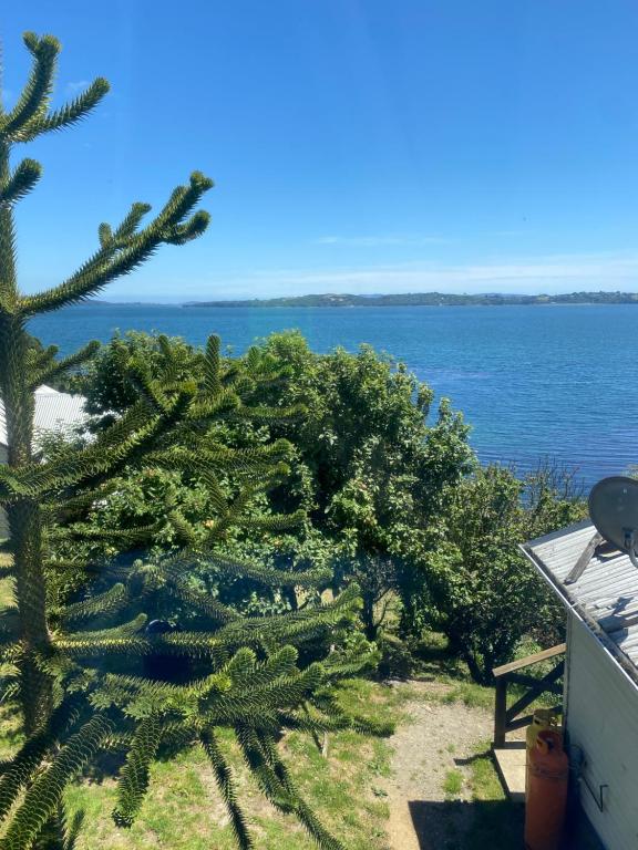 a view of the ocean from a house at apartment with sea view in Ancud