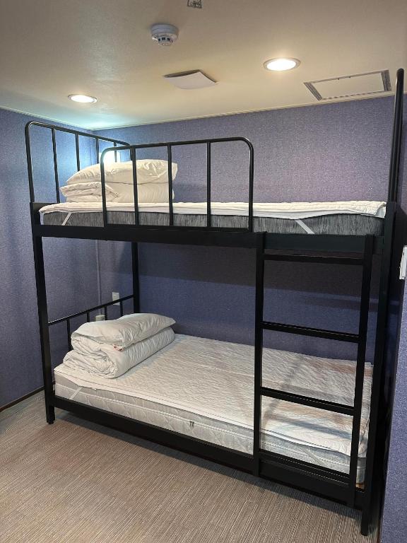 Postel nebo postele na pokoji v ubytování Soosong Guesthouse