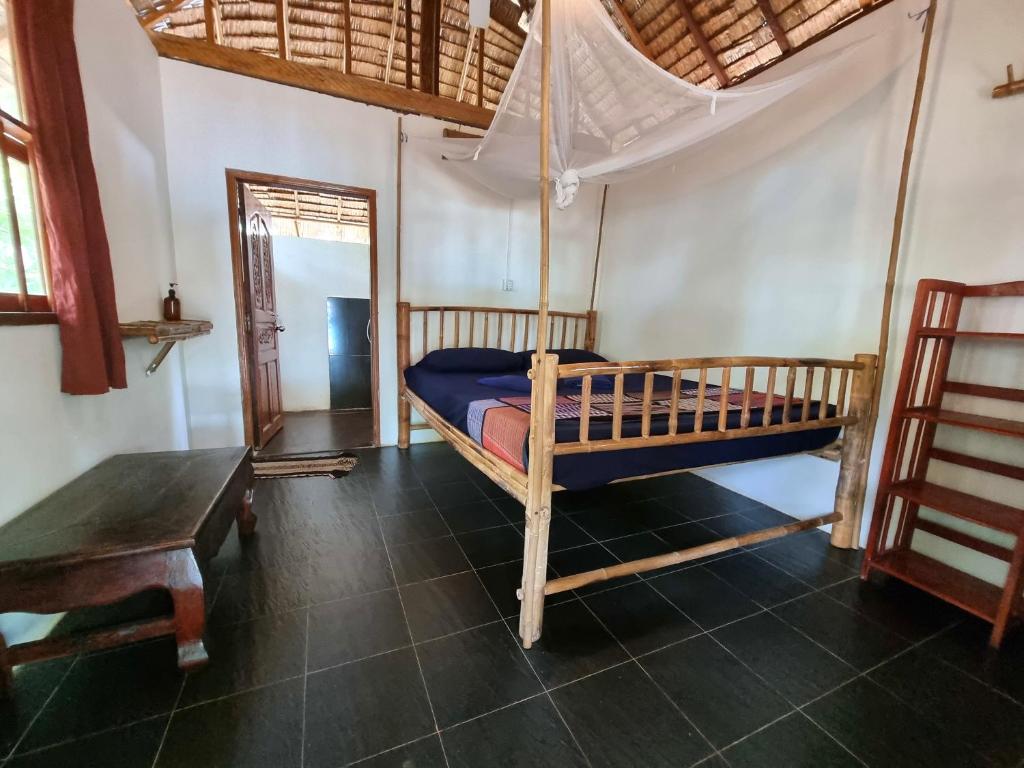 Postel nebo postele na pokoji v ubytování SunBoo Beach Bungalows