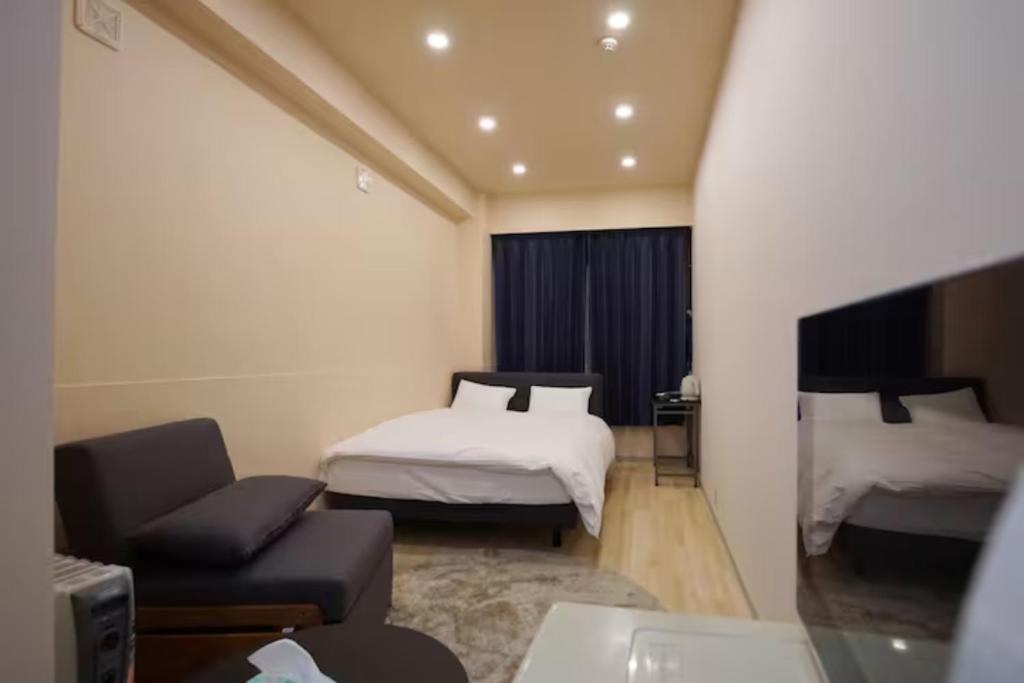 Postel nebo postele na pokoji v ubytování TokyoGuest 浜町