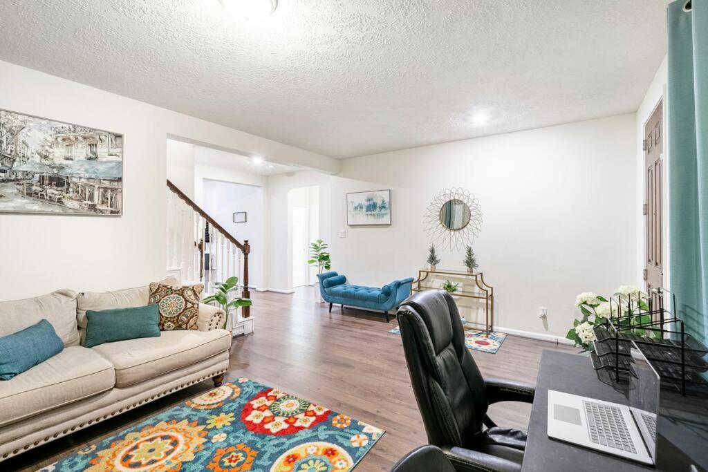 a living room with a couch and a table at Spacious long stay family home in Kingwood/Humble in Humble