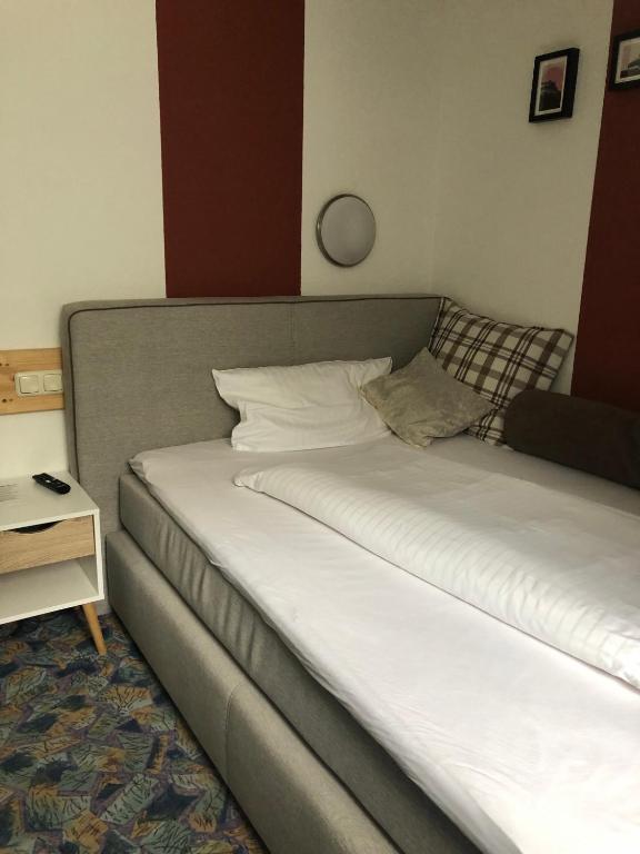 Postel nebo postele na pokoji v ubytování Seminarhotel Jakobsberg