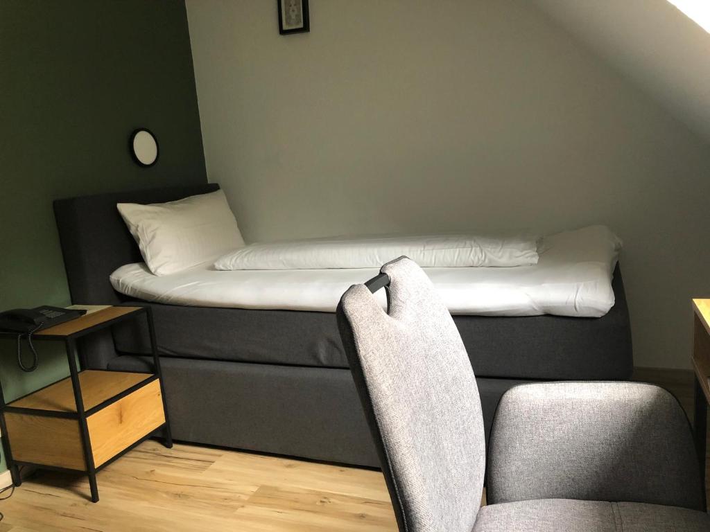 Postel nebo postele na pokoji v ubytování Seminarhotel Jakobsberg