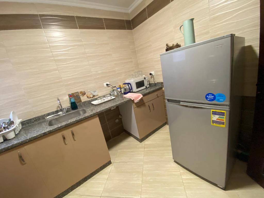 Kuchyň nebo kuchyňský kout v ubytování Cozy 2 BR in New Cairo City - Gated Compound