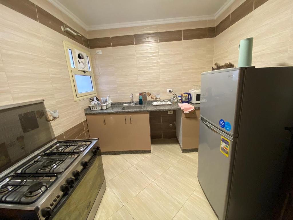 Kuchyň nebo kuchyňský kout v ubytování Cozy 2 BR in New Cairo City - Gated Compound