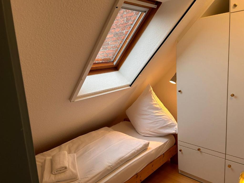 Postel nebo postele na pokoji v ubytování Kutscherhaus II
