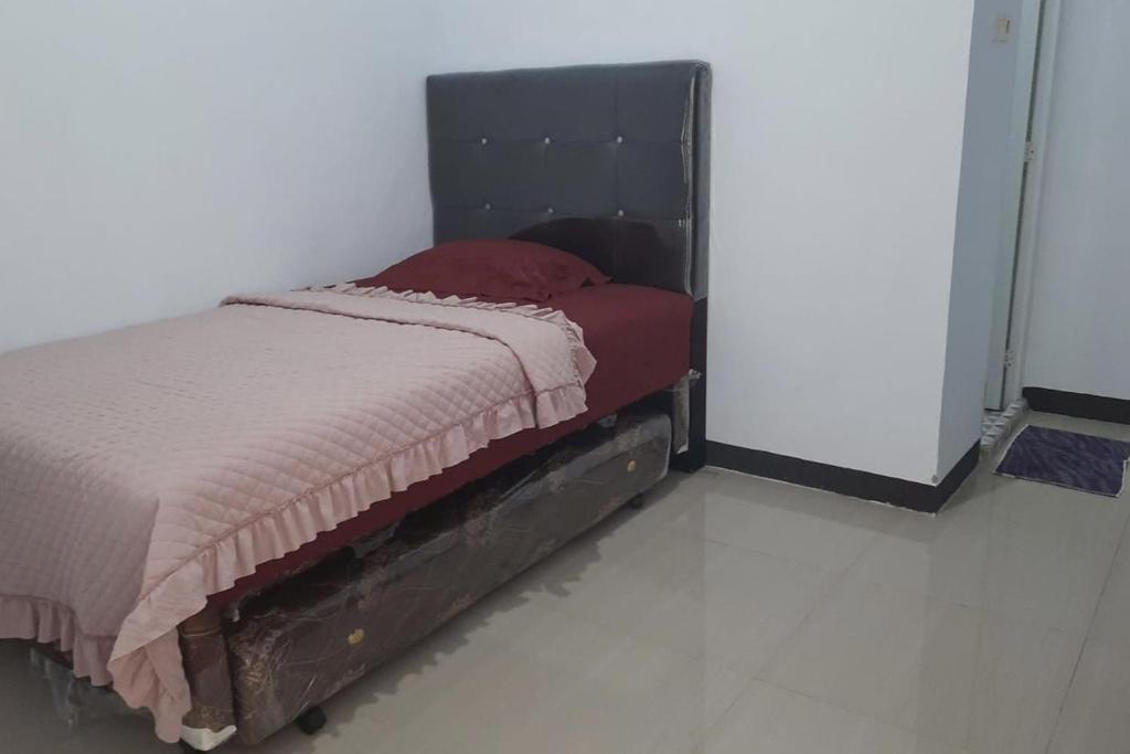 Postel nebo postele na pokoji v ubytování Pondokan Guest House Rinjani Syariah
