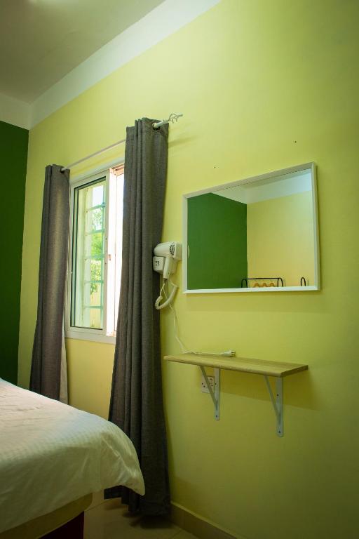 Postel nebo postele na pokoji v ubytování Nima guest house