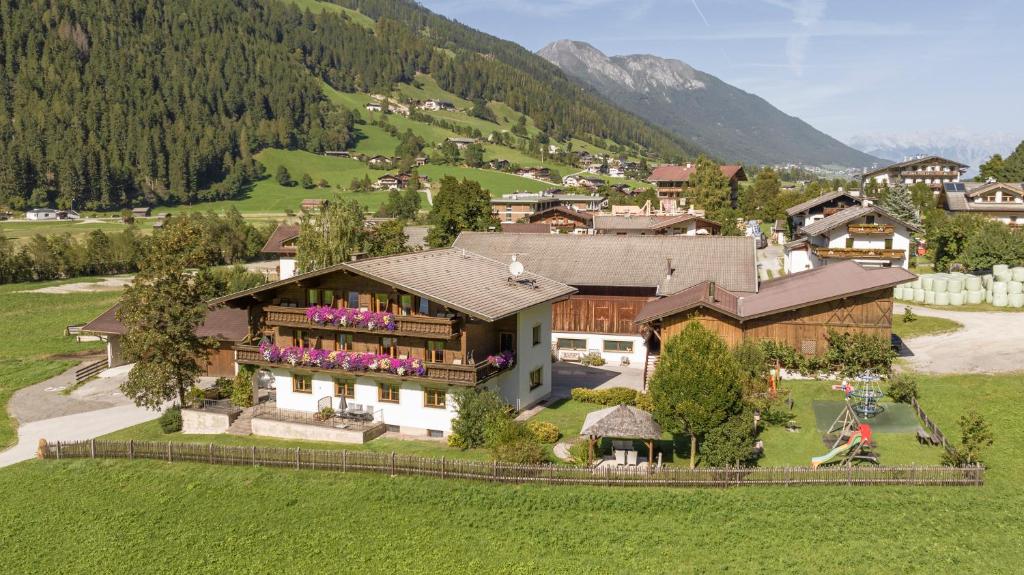 an aerial view of a house in a mountain at Ausserwieserhof in Neustift im Stubaital