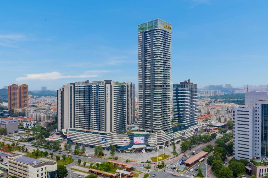 an aerial view of a city with tall buildings at Coco Apatement - Zhongshan Tianyi International Plaza Store in Zhongshan