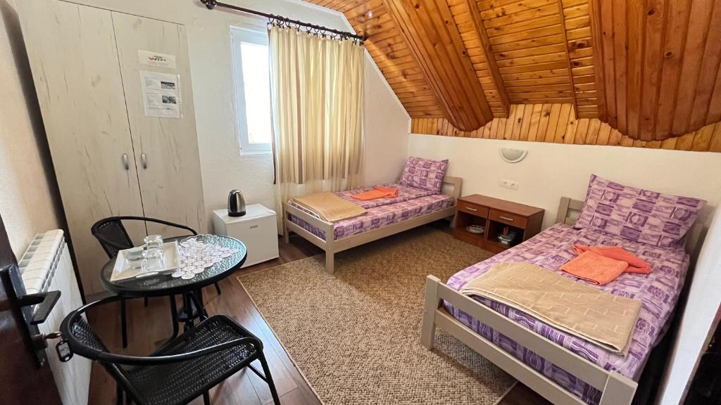 Postel nebo postele na pokoji v ubytování SNAM Rooms&Apartment
