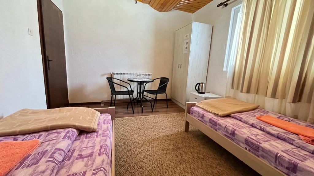 Postel nebo postele na pokoji v ubytování SNAM Rooms&Apartment