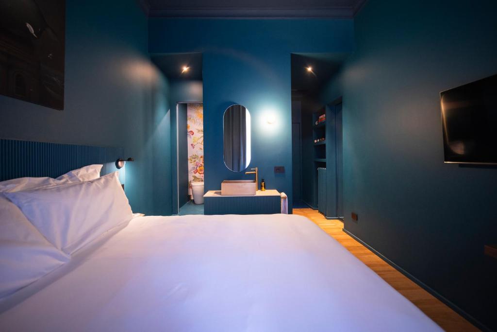 Postel nebo postele na pokoji v ubytování Fontana 16 Rooms
