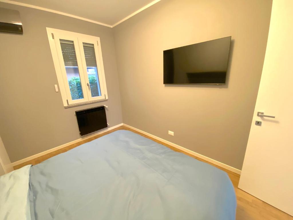 Televízia a/alebo spoločenská miestnosť v ubytovaní Zen House