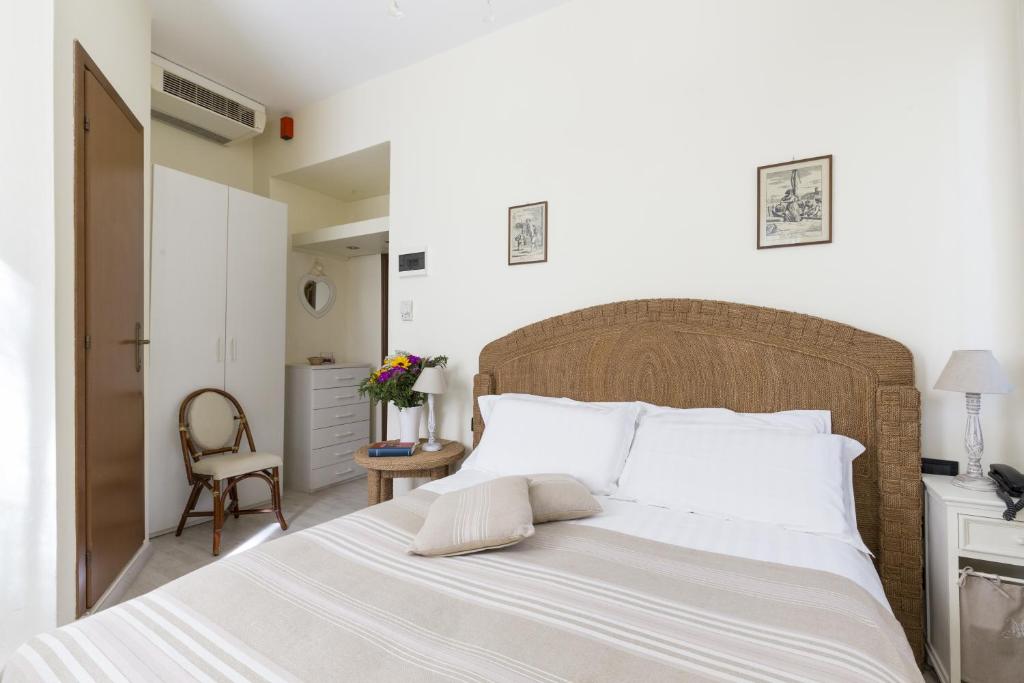 Postel nebo postele na pokoji v ubytování Hotel Villa Stella