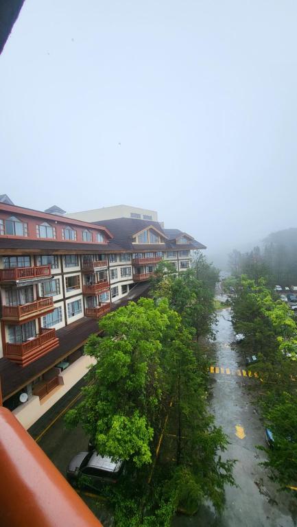 a view of a street with trees and buildings at Unit 551,Privately Owned, Superior Room At the Forest Lodge Camp John Hay, Mountain View, 2 Double Beds in Baguio
