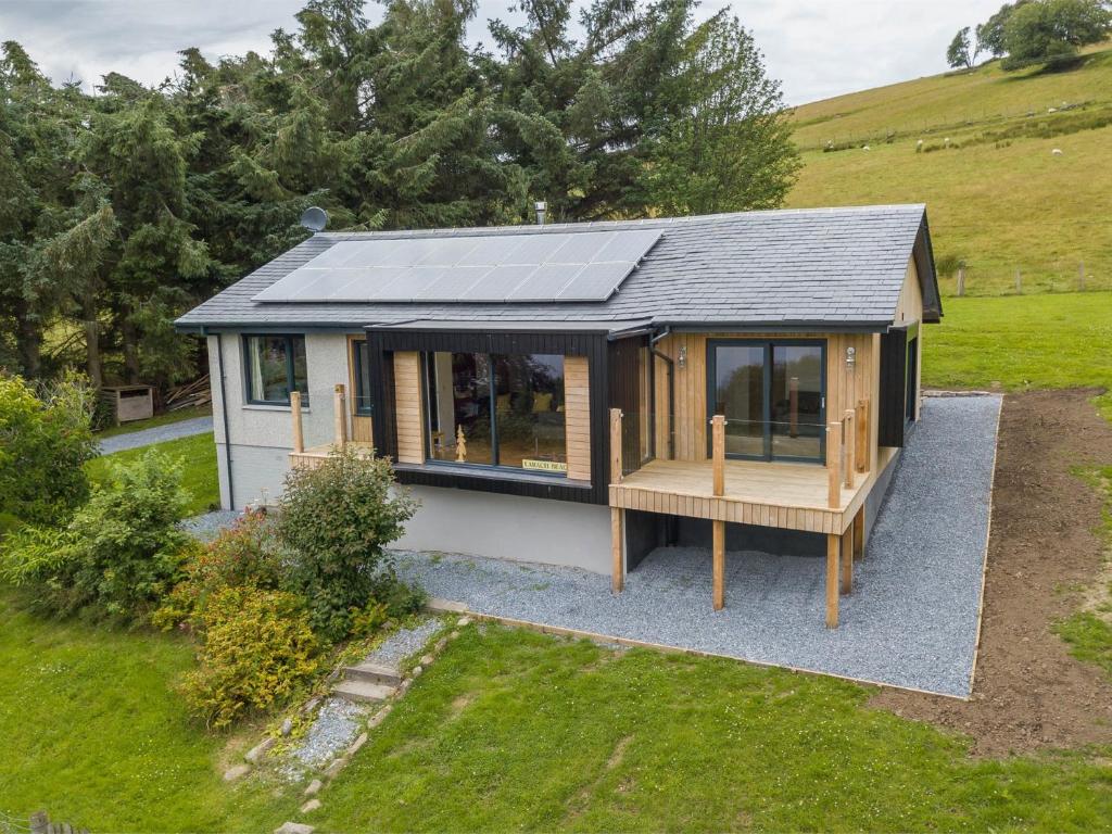 an overhead view of a tiny house with a solar roof at 3 Bed in Pitlochry CA207 in Struan