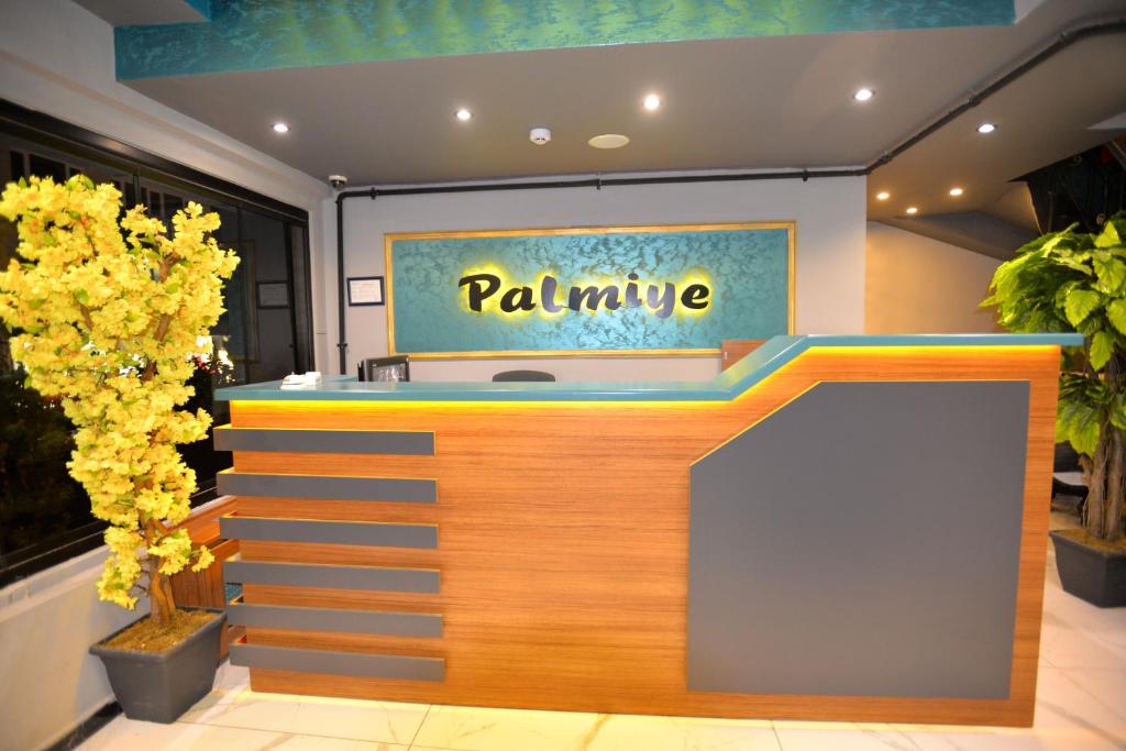 a store front with a palete sign on the wall at palmiye suıt otel in Istanbul