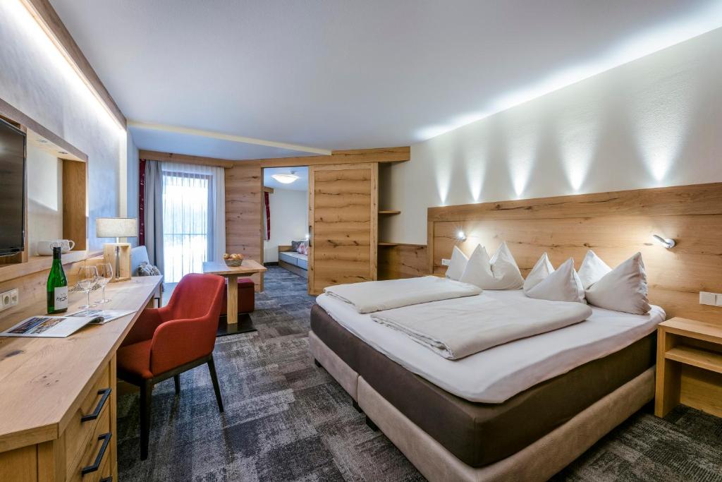 Postel nebo postele na pokoji v ubytování Hotel Kaiser in Tirol
