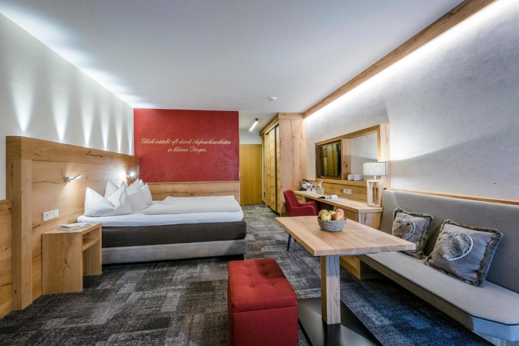 Postel nebo postele na pokoji v ubytování Hotel Kaiser in Tirol