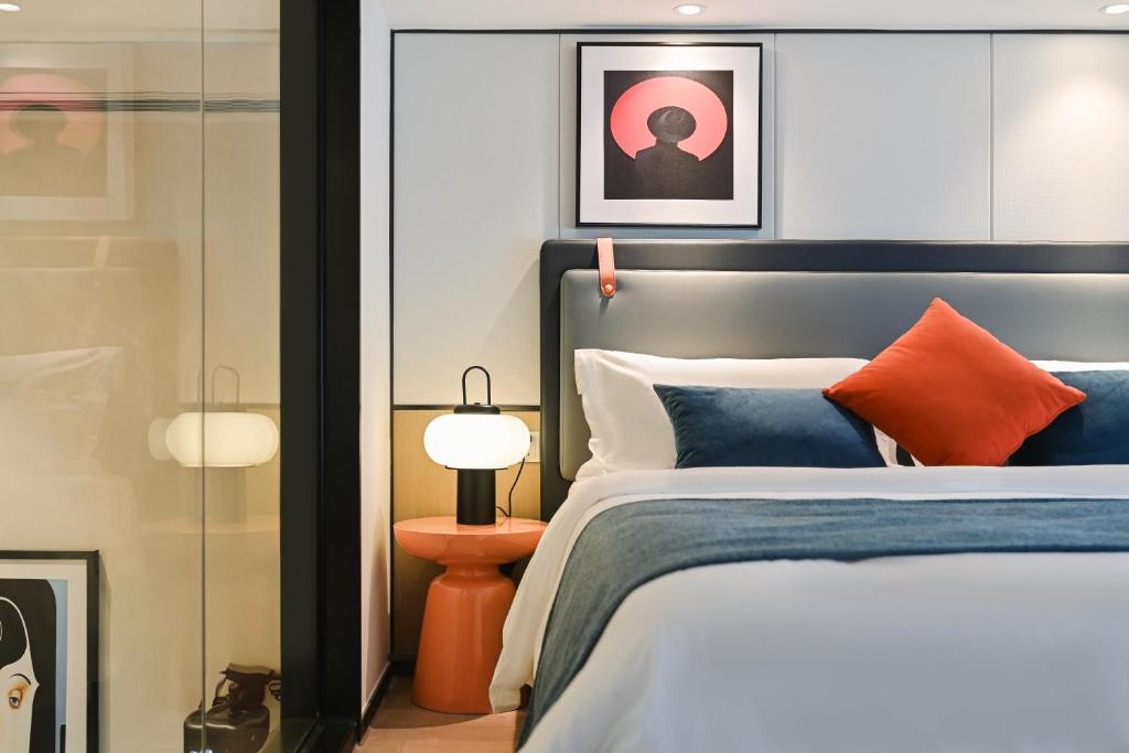 Postel nebo postele na pokoji v ubytování Livetour Hotel HaiZhu YiJing Road Metro Guangzhou
