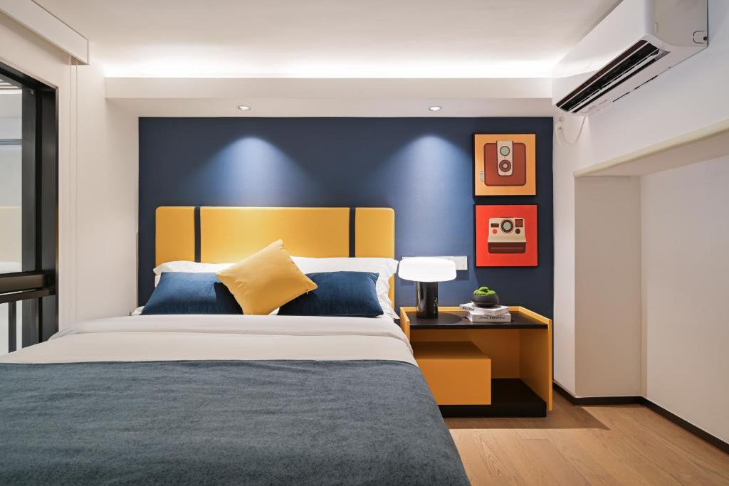 Postel nebo postele na pokoji v ubytování Livetour Hotel HaiZhu YiJing Road Metro Guangzhou