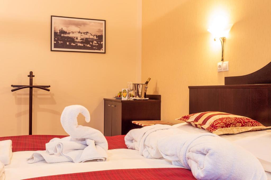 Postel nebo postele na pokoji v ubytování Hotel Studanka