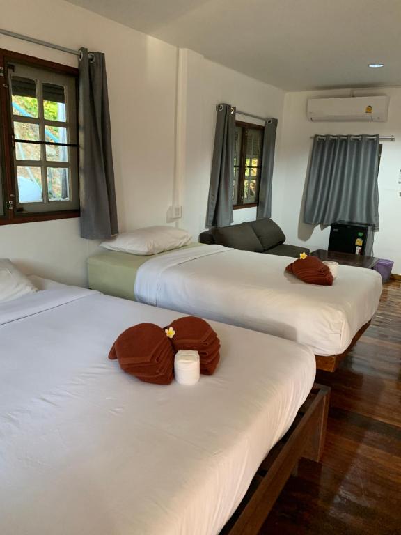Postel nebo postele na pokoji v ubytování Sam's House Kanchanaburi